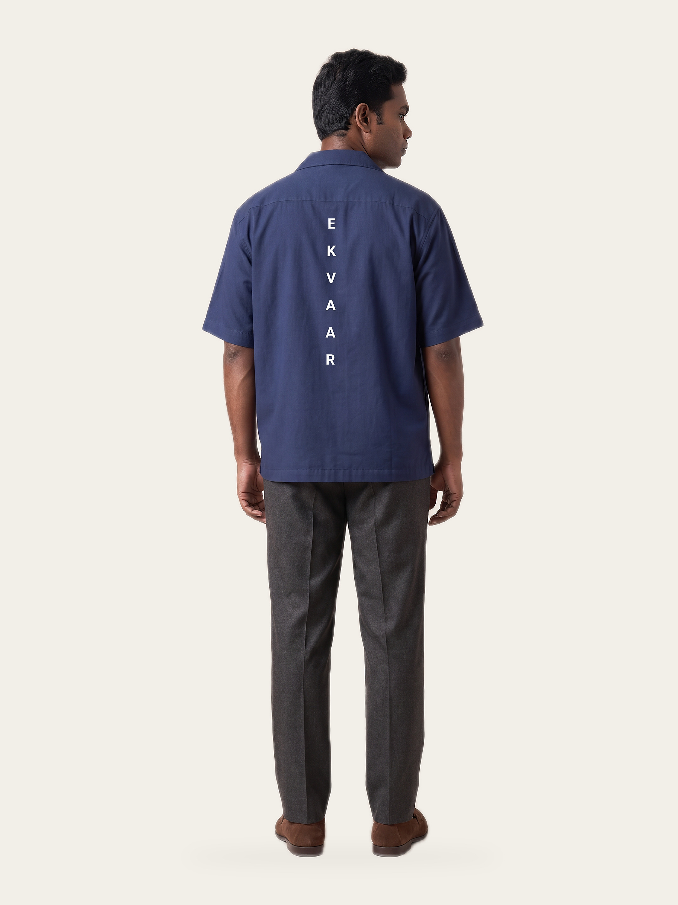 Column oversized shirt in Neel Blue, back, showing the vertical EKVAAR print