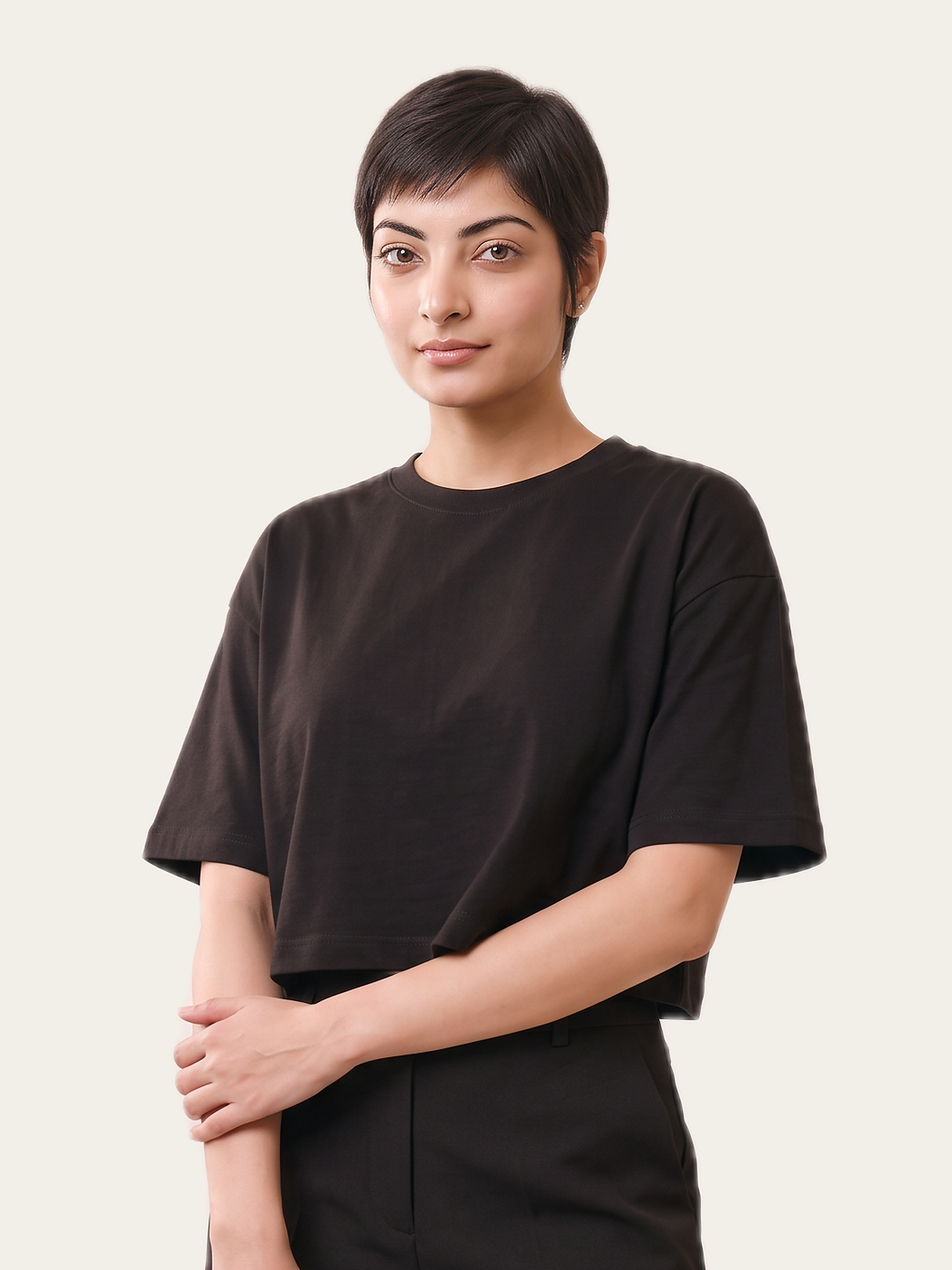 Woman wearing a Noor Black cropped crew neck tee with half sleeves