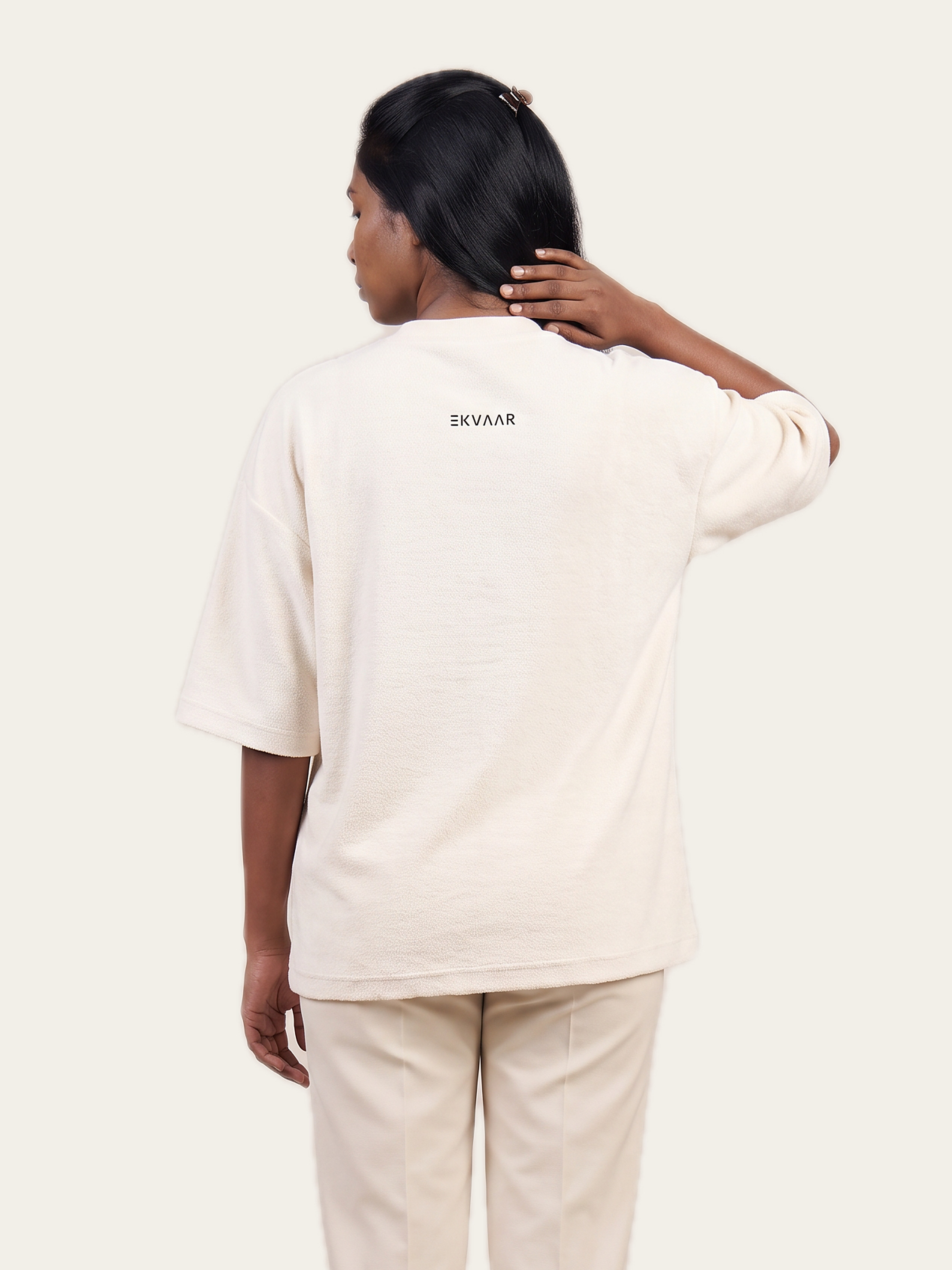 ESSENCE terry tee in Rui White, back view, worn by a model