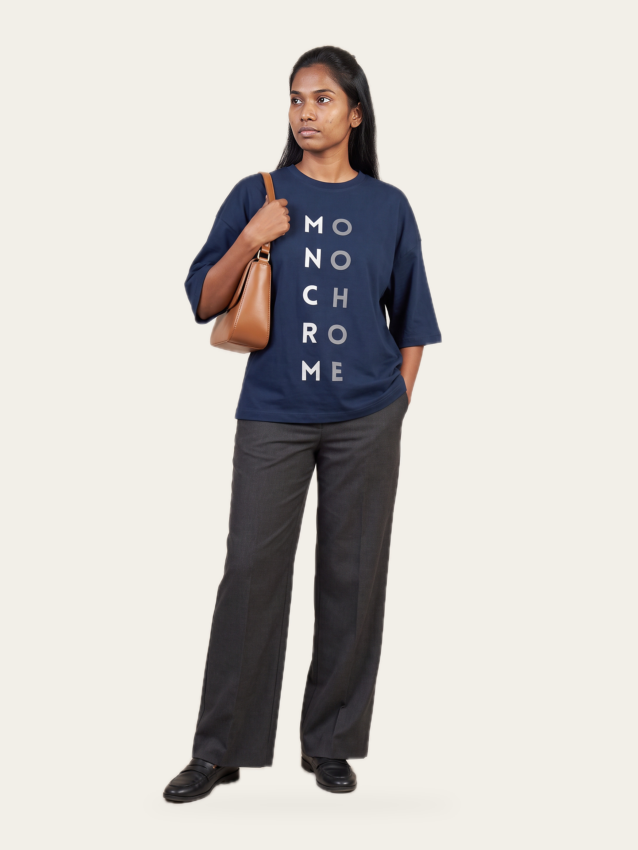 Monochrome oversized tee in Neel Blue, front, with grey trousers