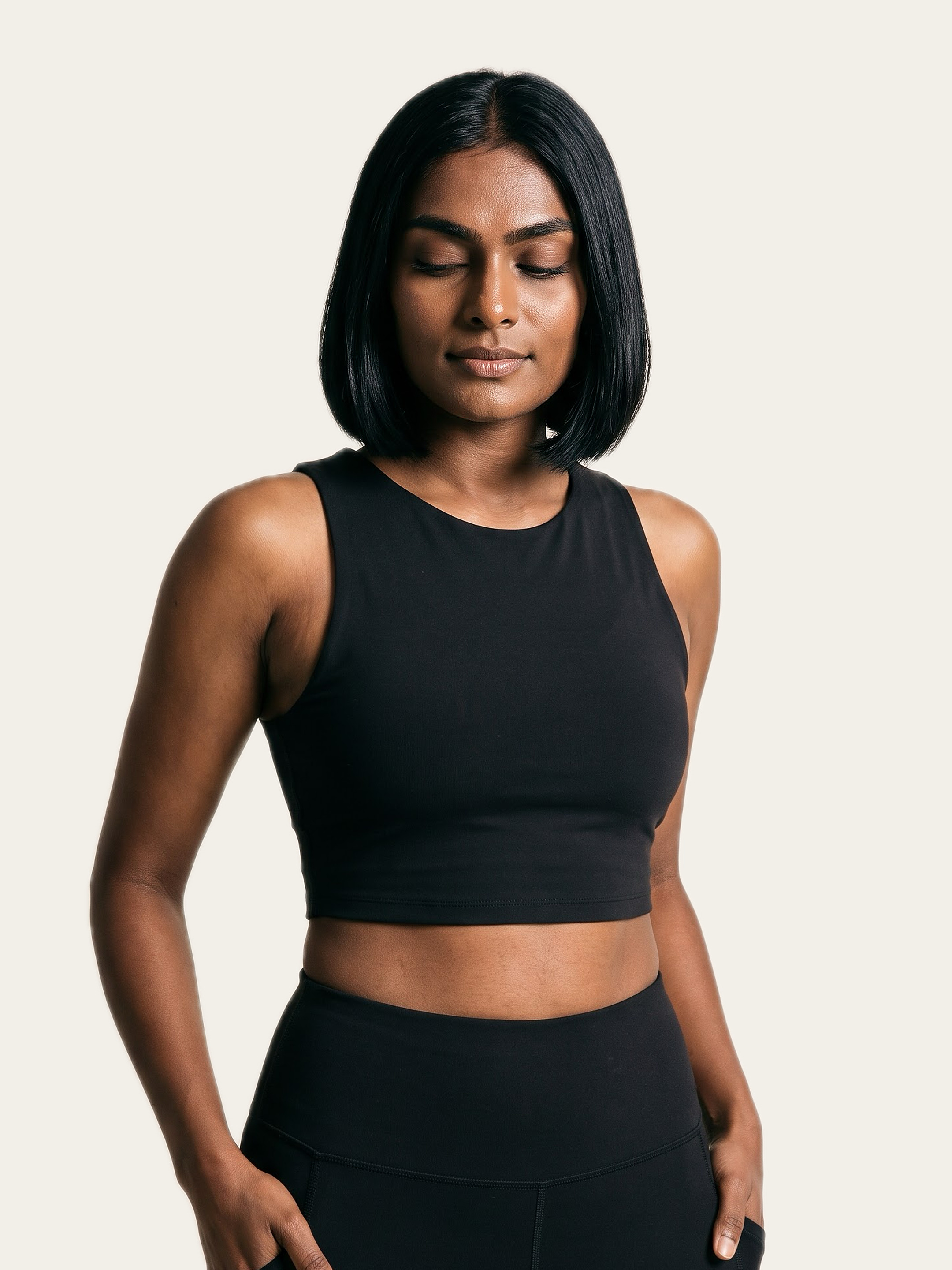 MOVE Sports Crop Top in Noor Black, styled, worn by a model