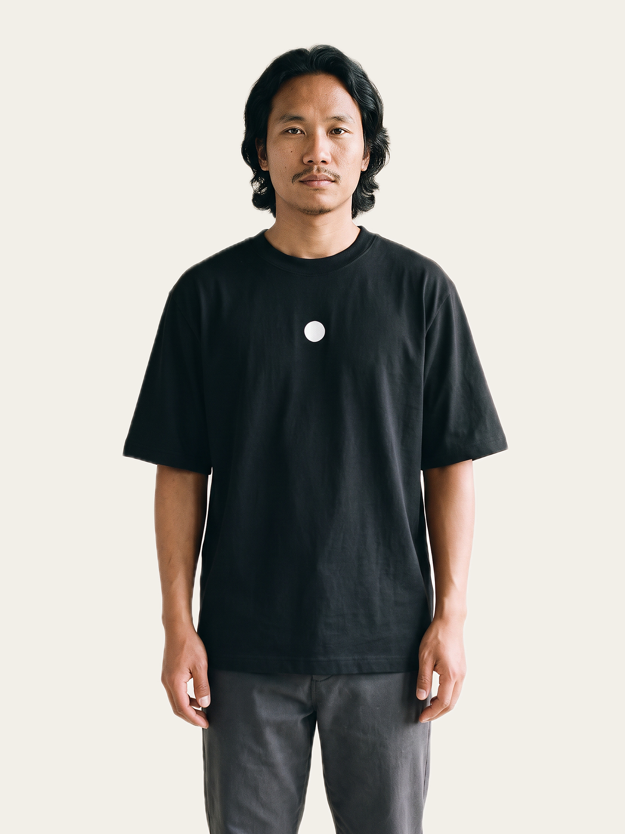 NAKED Dot Oversized Tee in Noor Black, worn by a model