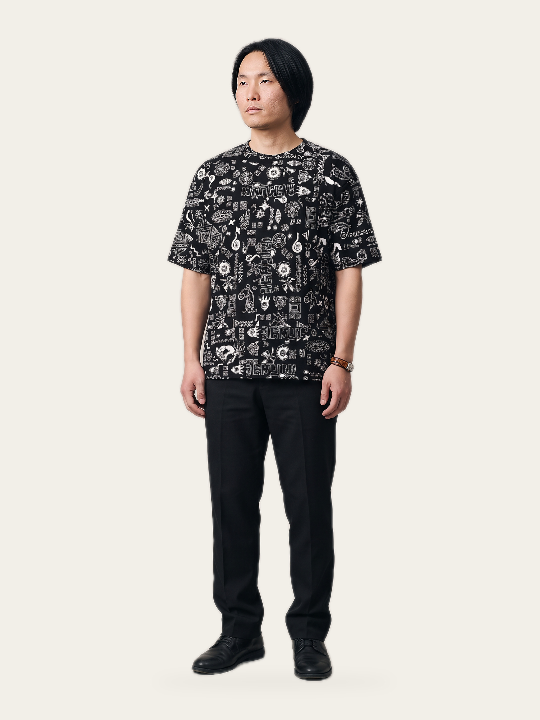 Model wearing the Tribal Print Oversized T-Shirt in Noor Black, front view, Indian streetwear from EKVAAR