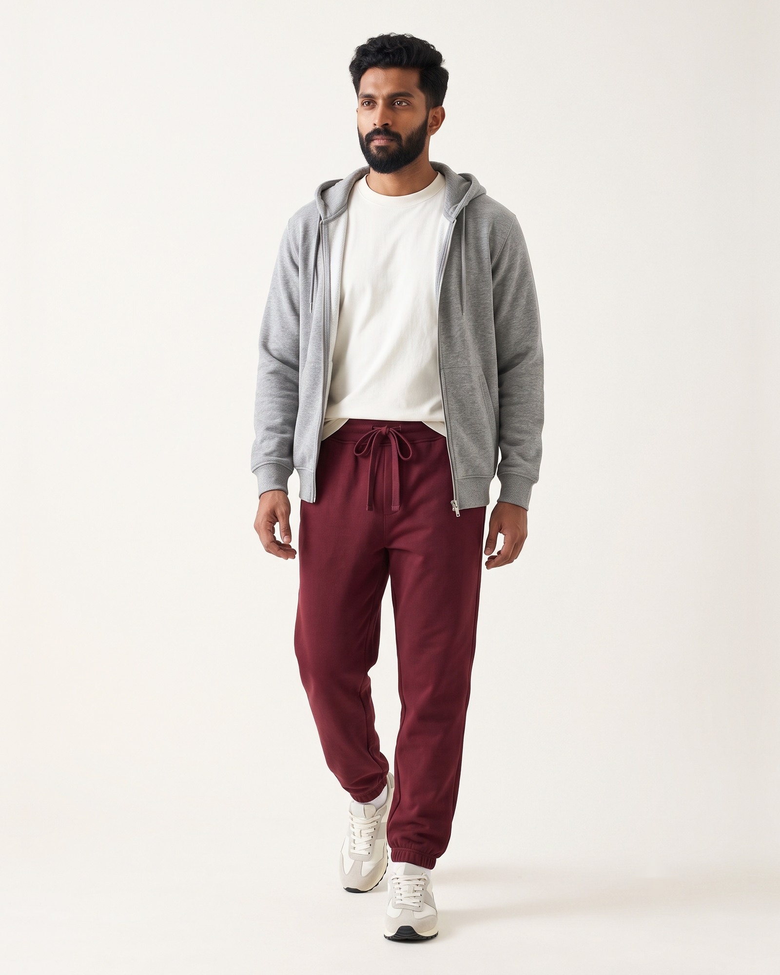 EASE joggers in Agni Red, worn with a grey zip hoodie