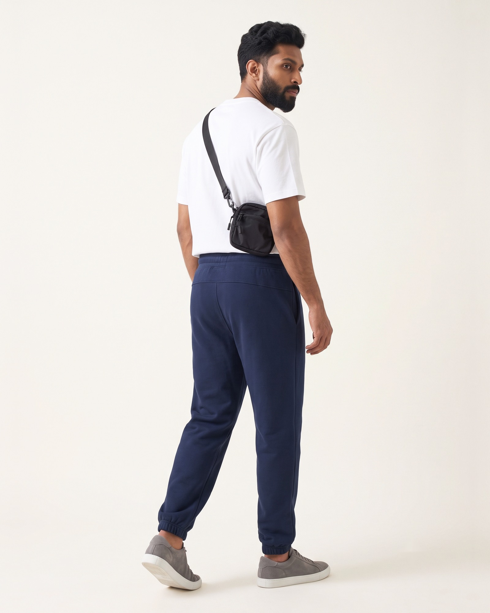 EASE Joggers in Neel Blue, back view, worn by a model, the relaxed high-waist jogger to pair with a baby tee