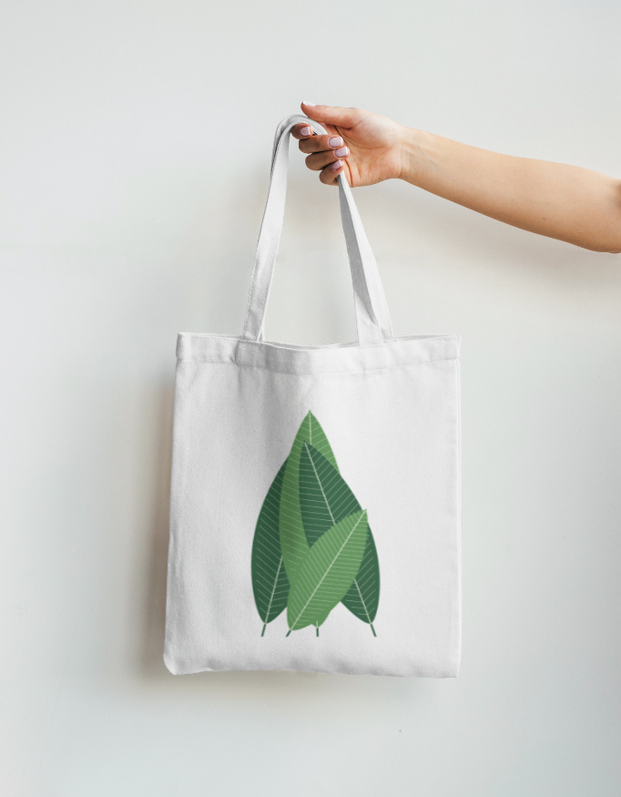 BANANA LEAF tote in Rui White, printed banana-leaf fan, held by hand