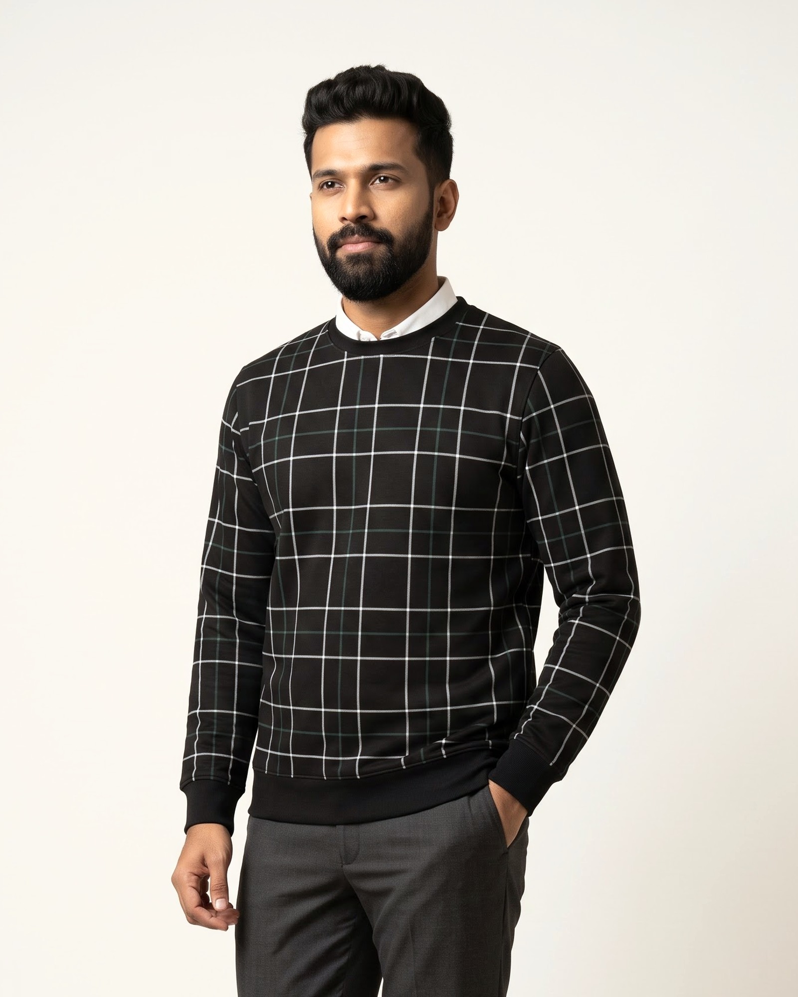 JAALI sweatshirt in Noor Black, worn over a white shirt collar