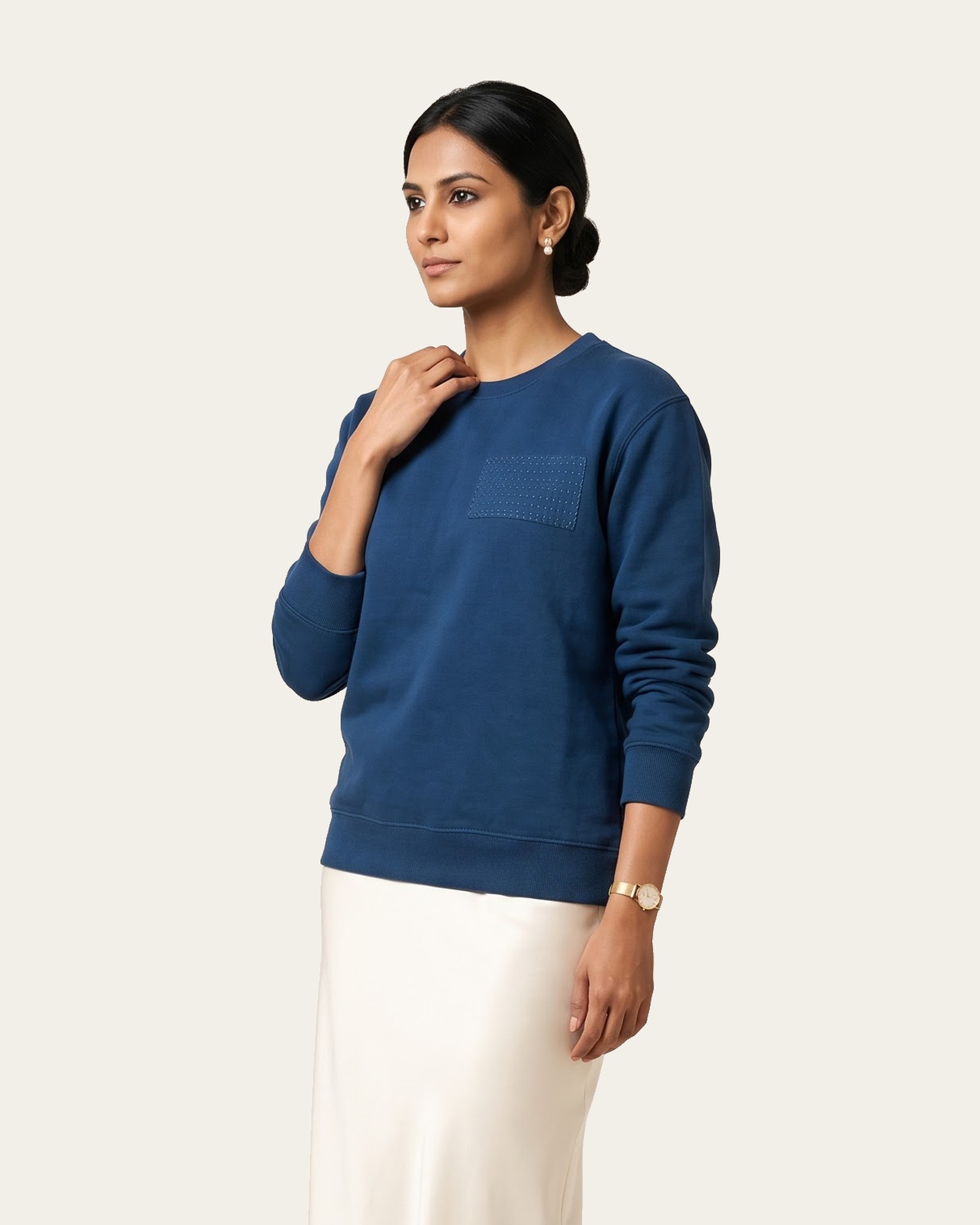 KANTHA ROWS sweatshirt in Neel Blue, worn with a cream skirt